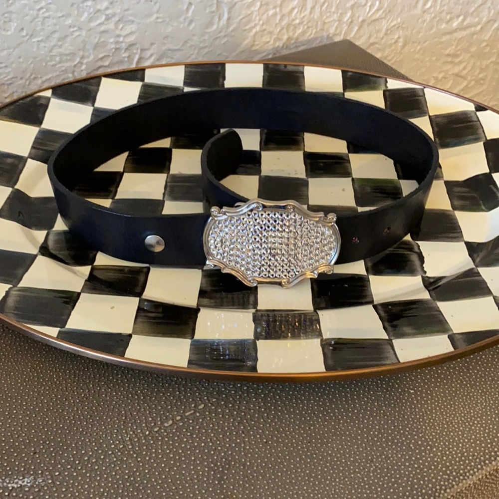 Leather belt with rhinestone buckle.
